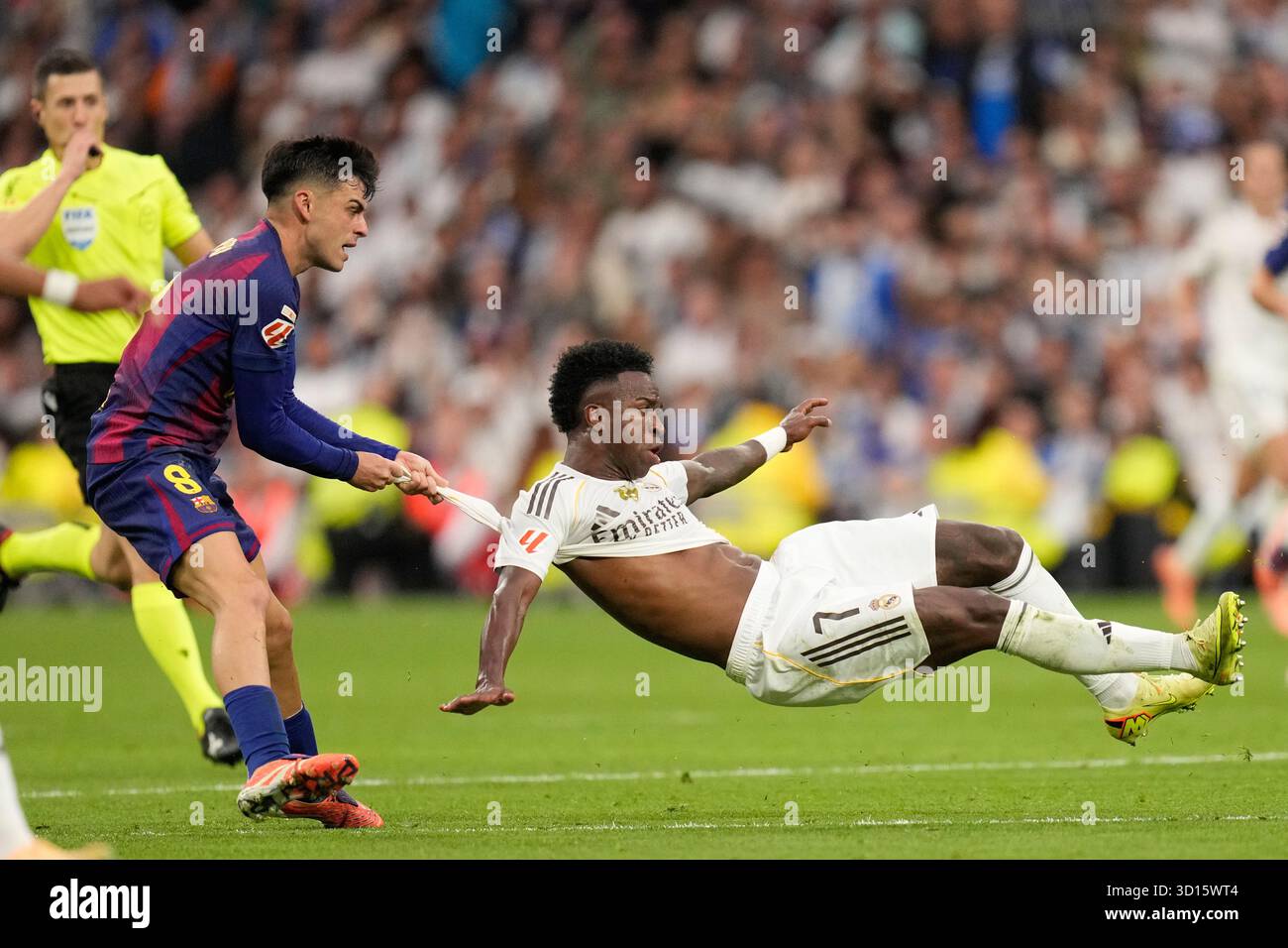 Barcelona s Pedri Pulls Real Madrid s Vinicius Junior During A La Liga 