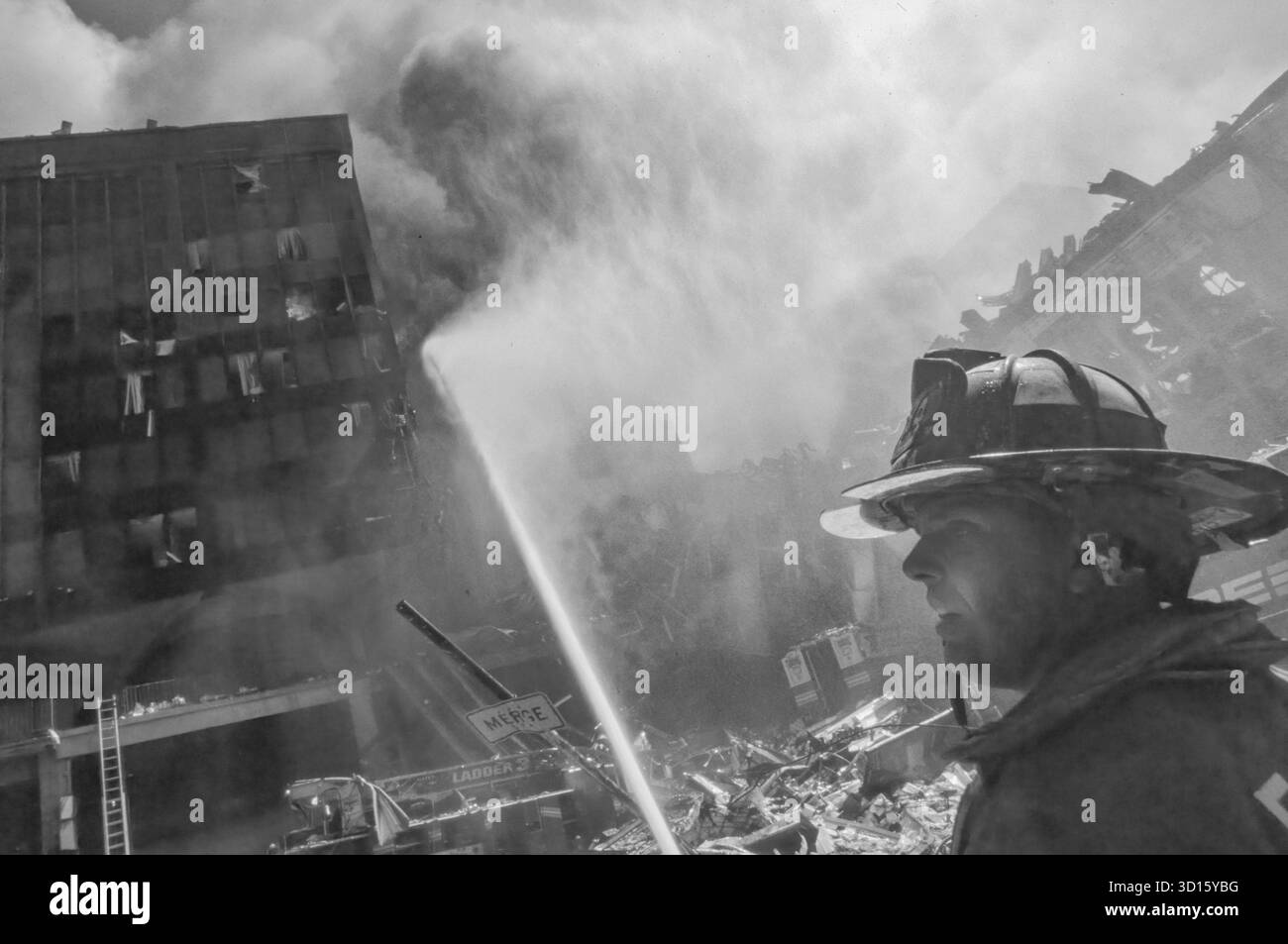 Wtc Fire NYFD fire-fighter-in-front-of-burning-building-and-rubble-following ...