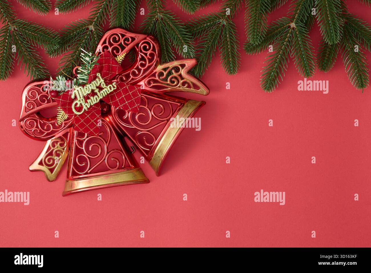 Christmas bells decoration with snowflakes and fir branches on red festive  background Stock Photo - Alamy, image size:1300x956