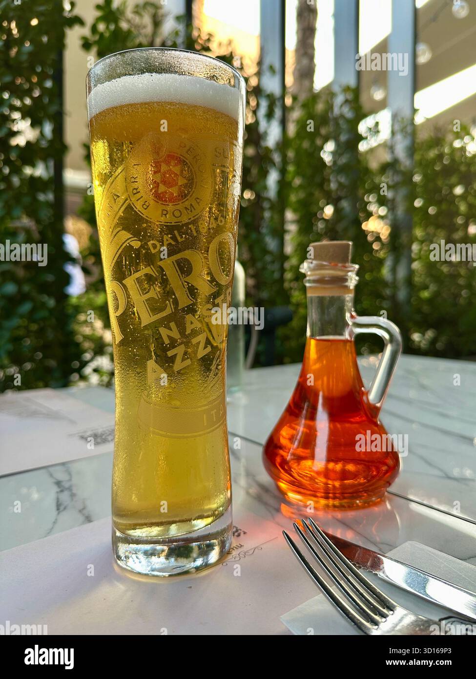 Pint of Peroni on table outside - Smartphone Captured Stock Image