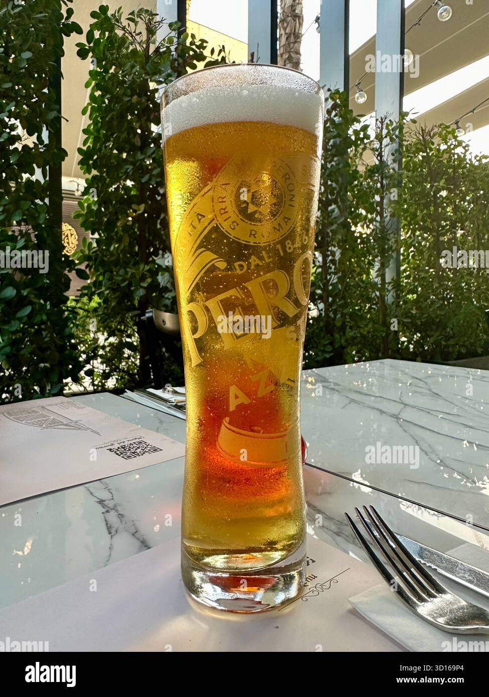 Pint of Peroni on table outside - Smartphone Captured Stock Image
