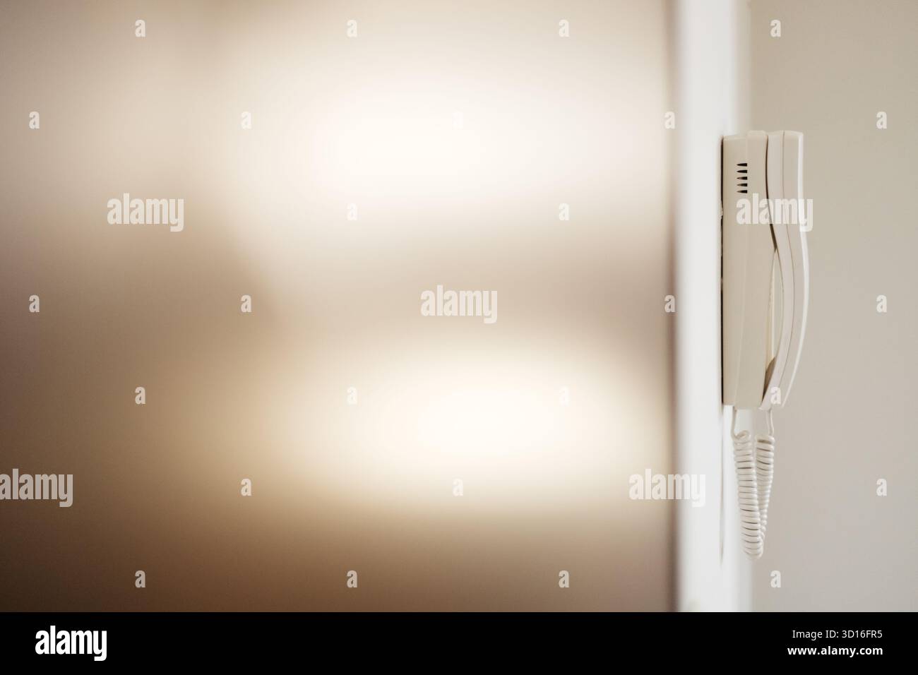 white intercom on the wall Stock Photo