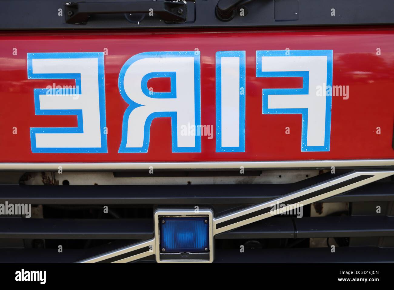 Fire lettering painted in reverse on front of fire engine Stock Photo ...