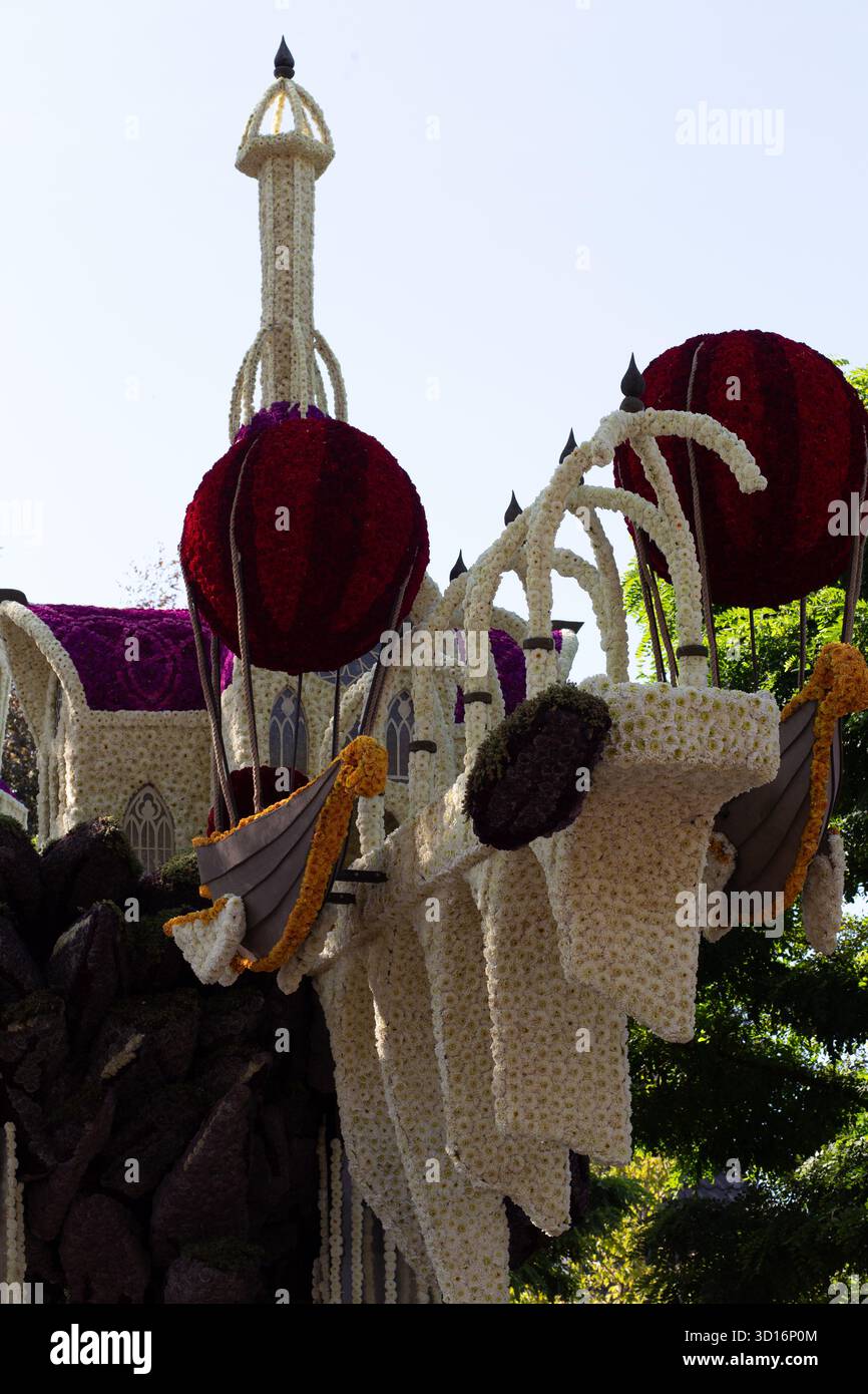 Structured Parade Strong daylight close view of flower-covered parade float platform ...