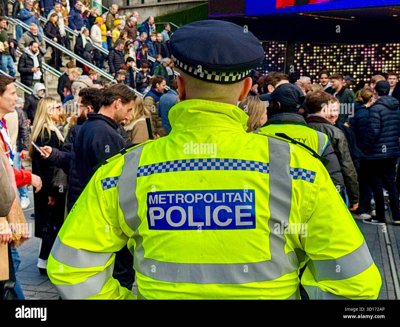 London, England, UK - 25 October 2025: Police officers from the Metropolitan Police on duty outside Wembley Stadium for a major sporting event - Smartphone Captured Stock Image