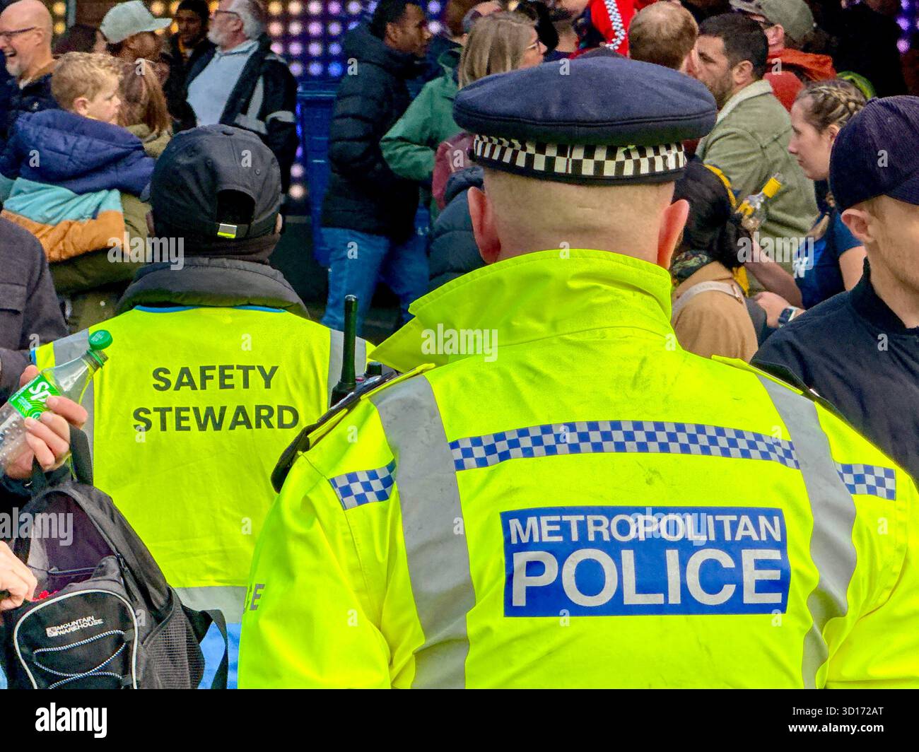 London, England, UK - 25 October 2025: Police officers from the Metropolitan Police on duty outside Wembley Stadium for a major sporting event - Smartphone Captured Stock Image