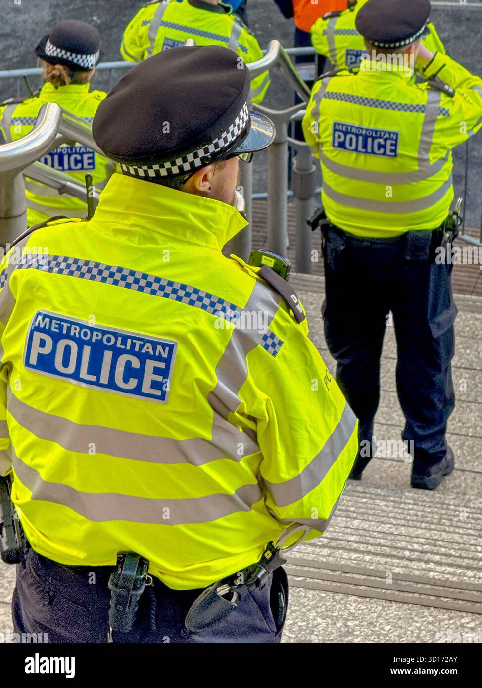 London, England, UK - 25 October 2025: Police officers from the Metropolitan Police on duty outside Wembley Stadium for a major sporting events - Smartphone Captured Stock Image