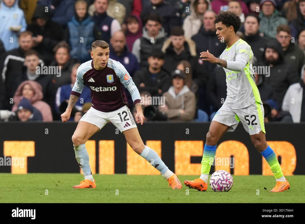Oscar Bobb of Manchester City under pressure from Lucas Digne of Aston ...