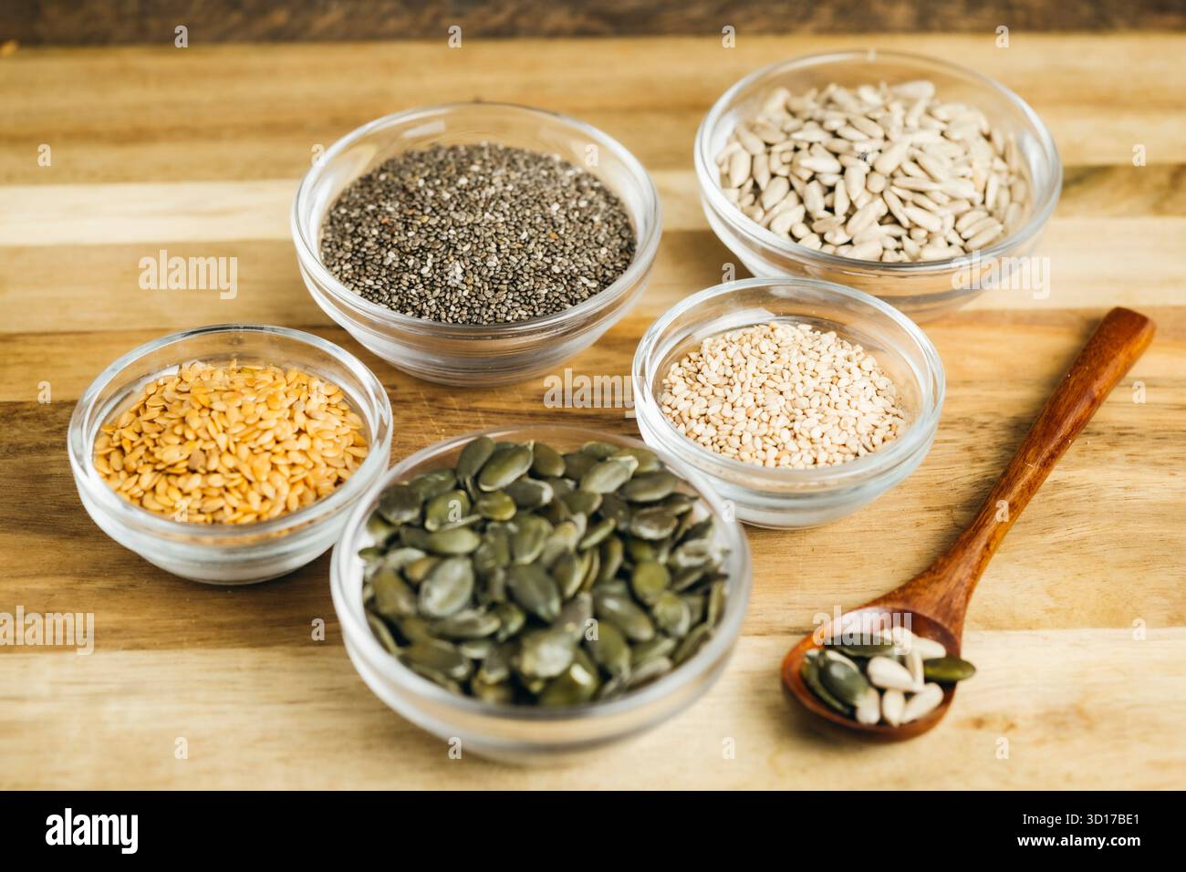 Small bowls filled with different types of seeds — flaxseed, chia ...
