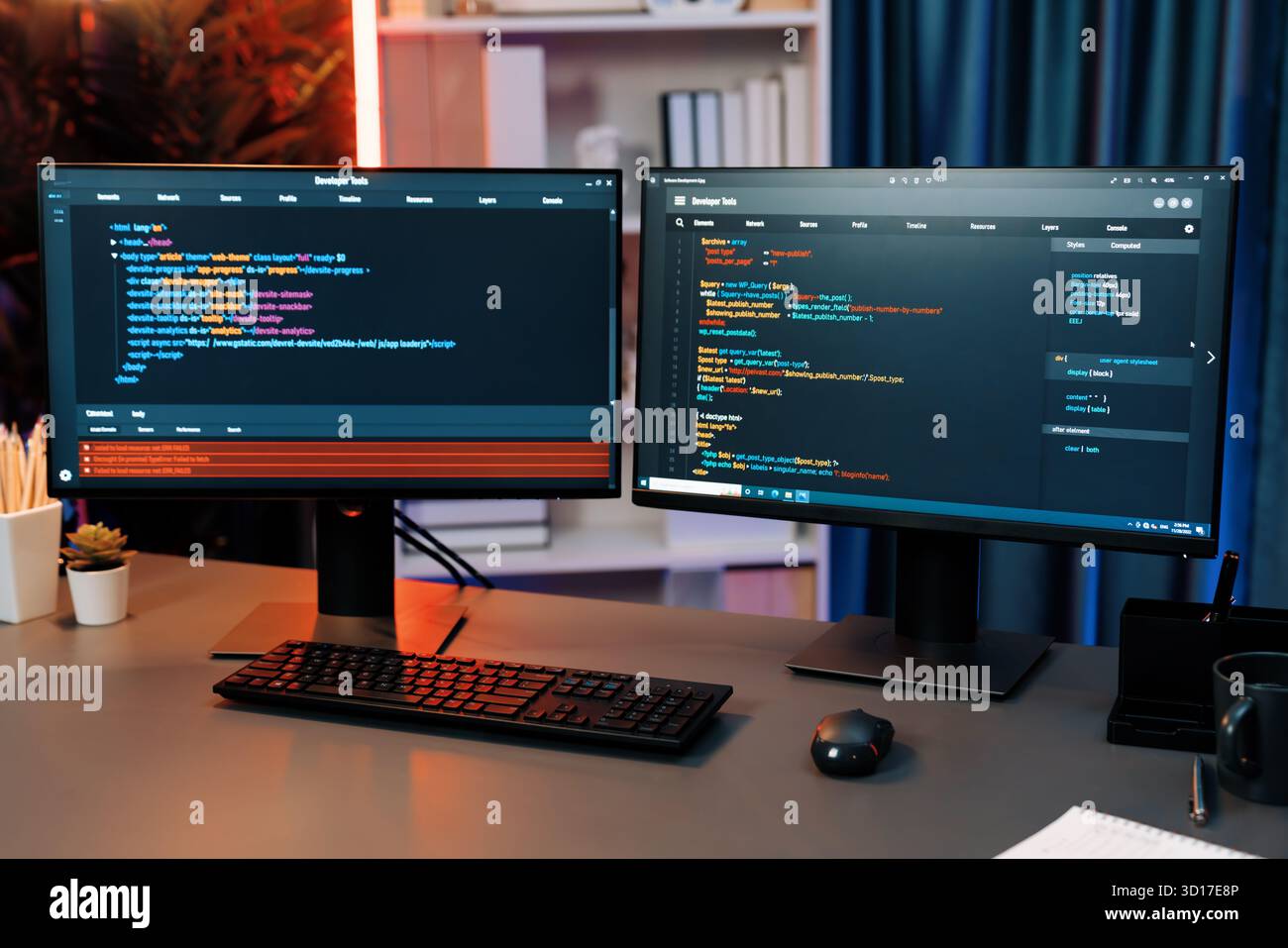 Programming code on computer two screens on desktop placing working desk showing intelligent website development coder system running data online info Stock Photo