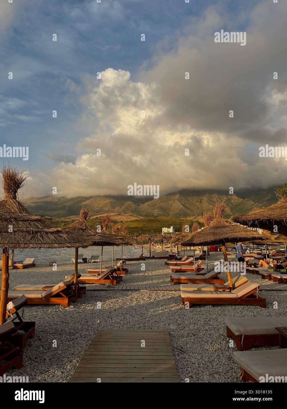 Scenic views of the Albanian Riviera coastline and beach resorts, including a dramatic beach scene, a picturesque a sunny view of the resorts - Smartphone Captured Stock Image