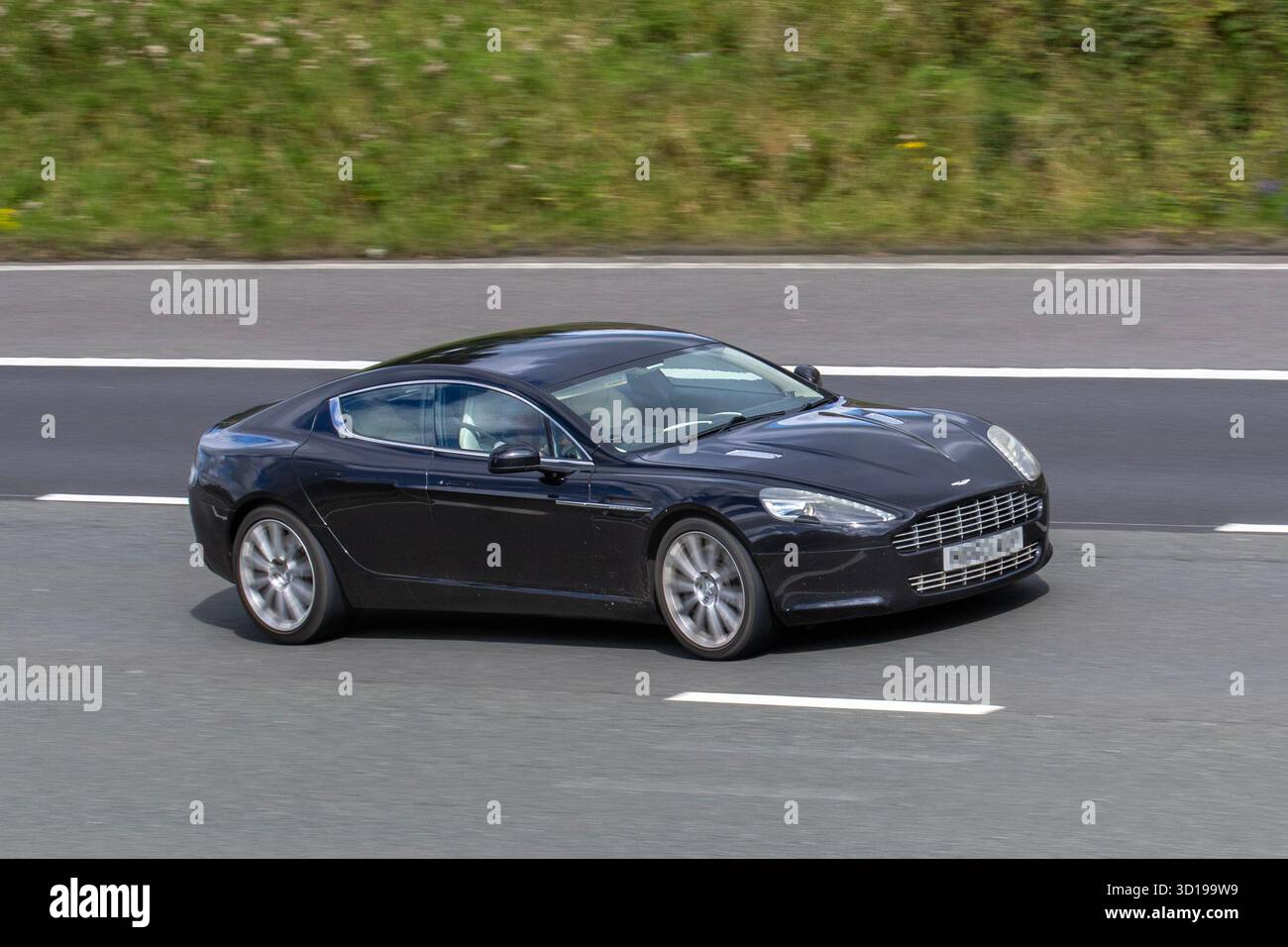 2010 Black Aston Martin Rapide V12 Auto, four-door luxury sedan 6.0- litre  V12 engine, GT sports coupe Stock Photo - Alamy, image size:1300x956