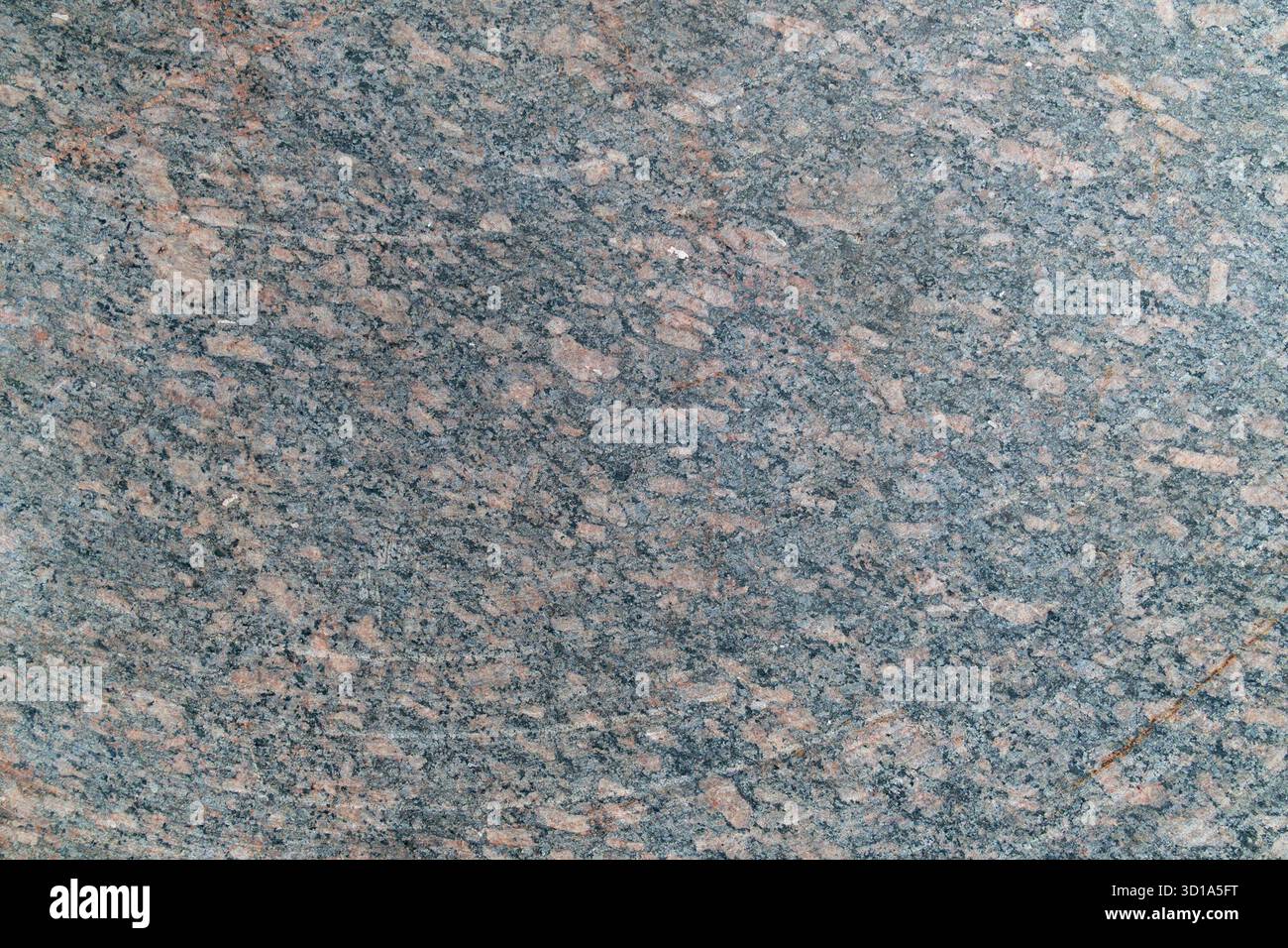 Granite surface texture with speckled gray and pink patterns. Stock Photo