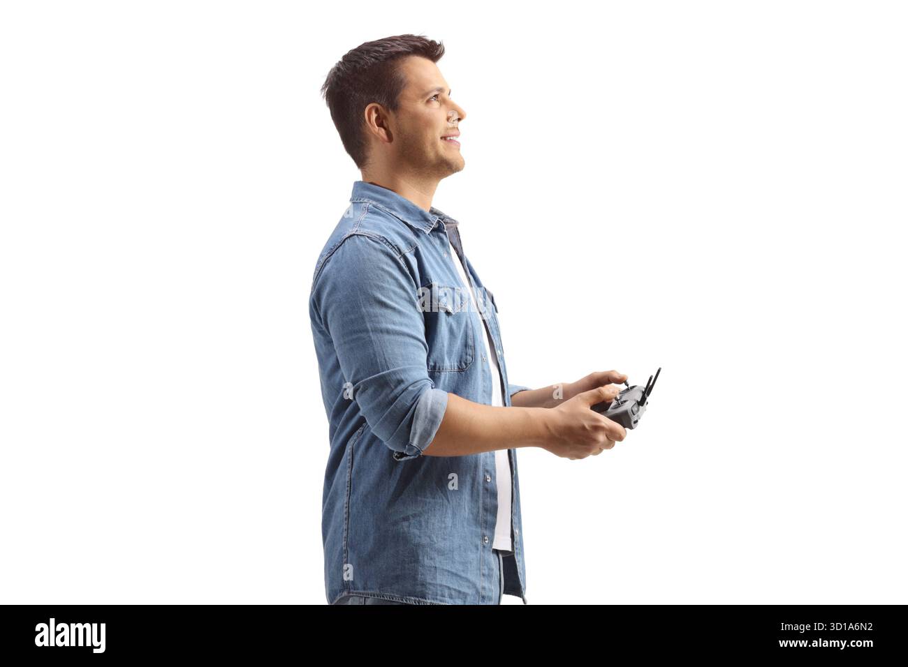 Man holding a drone remote cotroller isolated on white background Stock Photo