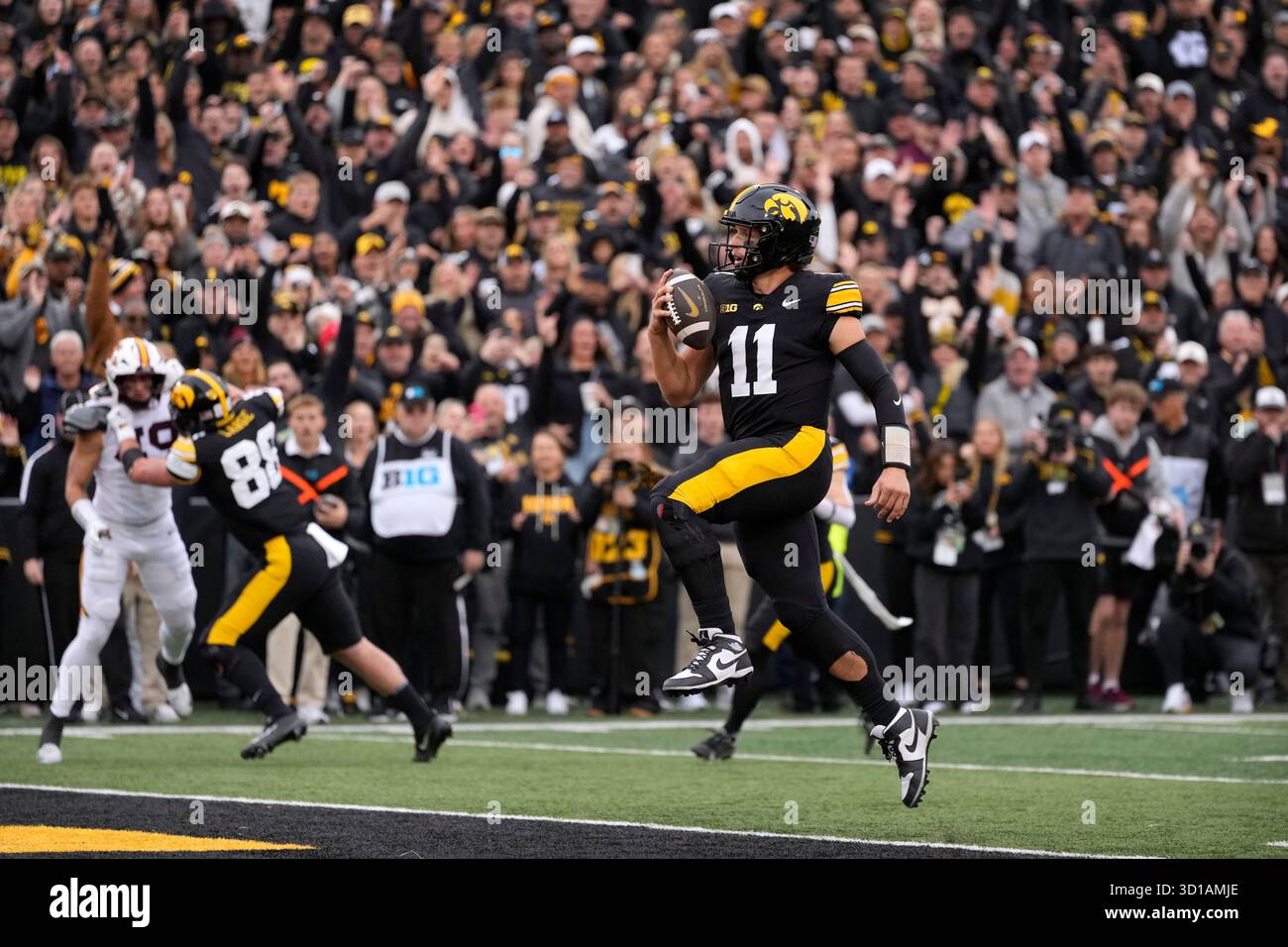Gronowski Iowa quarterback Mark Gronowski scores a touchdown during the first ...