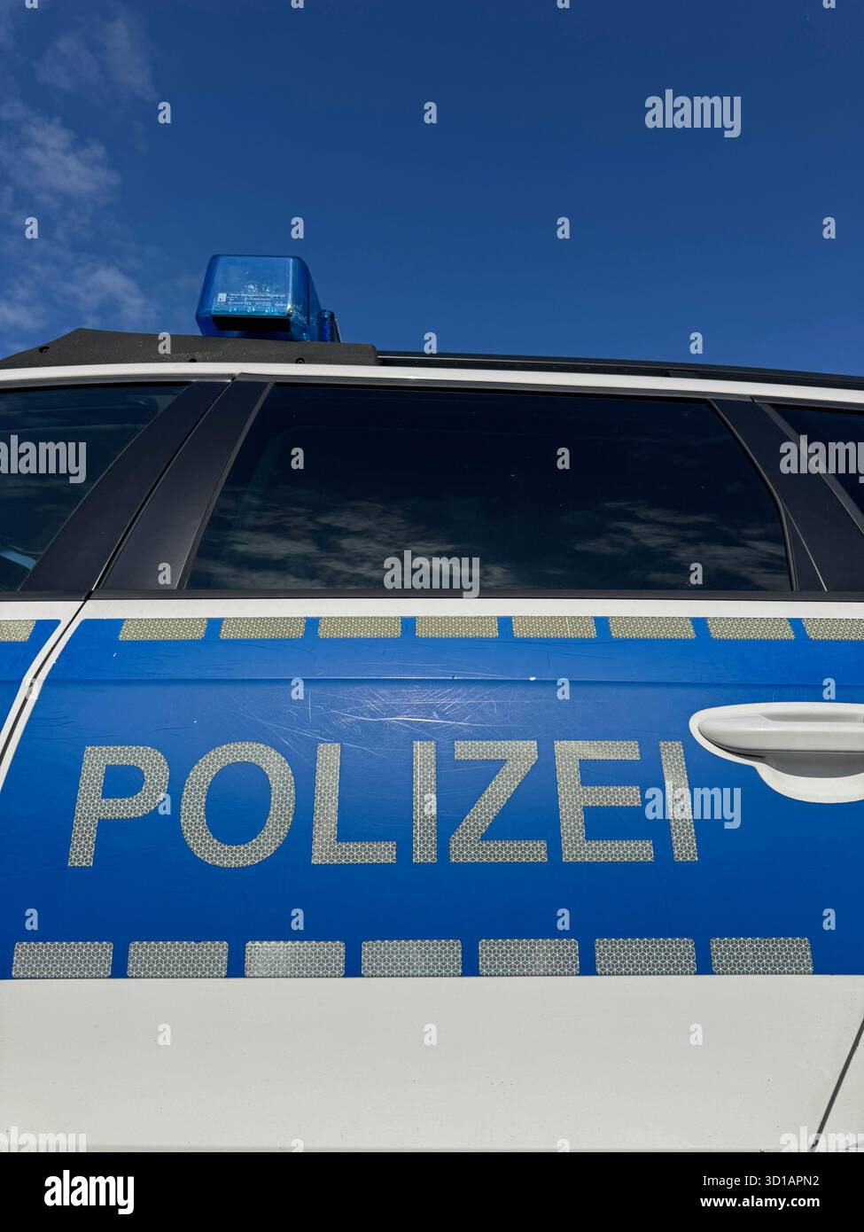 Blue and white police car with a blue stripe on the side Stock Photo ...