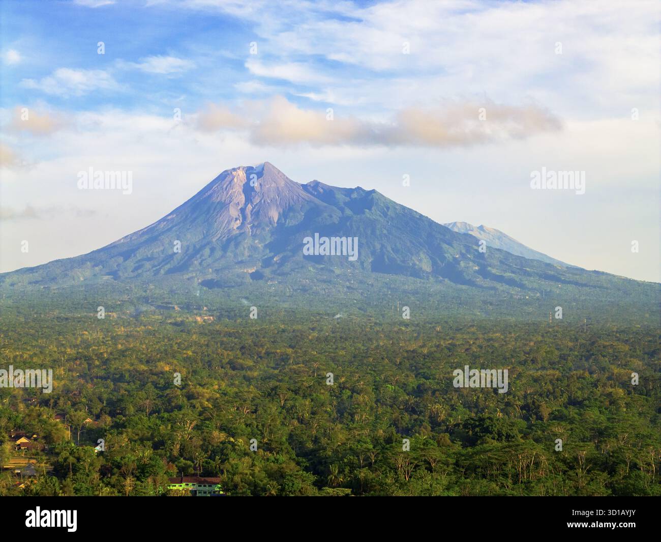 Aerial view of imposing Merapi Mountain rises majestically, its slopes ...