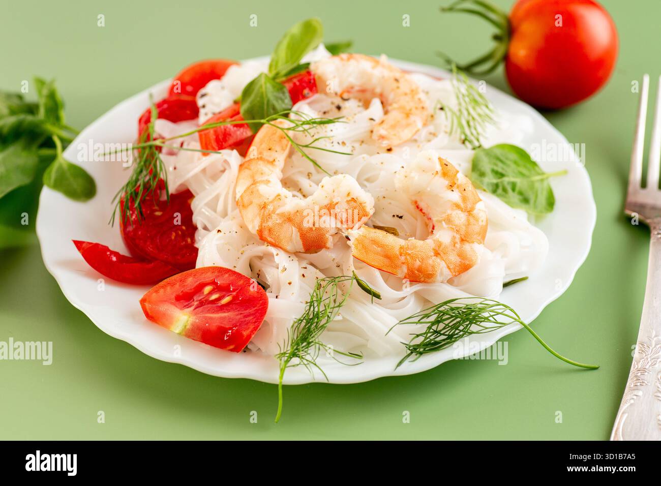 Culinary presentation of boiled rice noodles with shrimp and vegetables ...