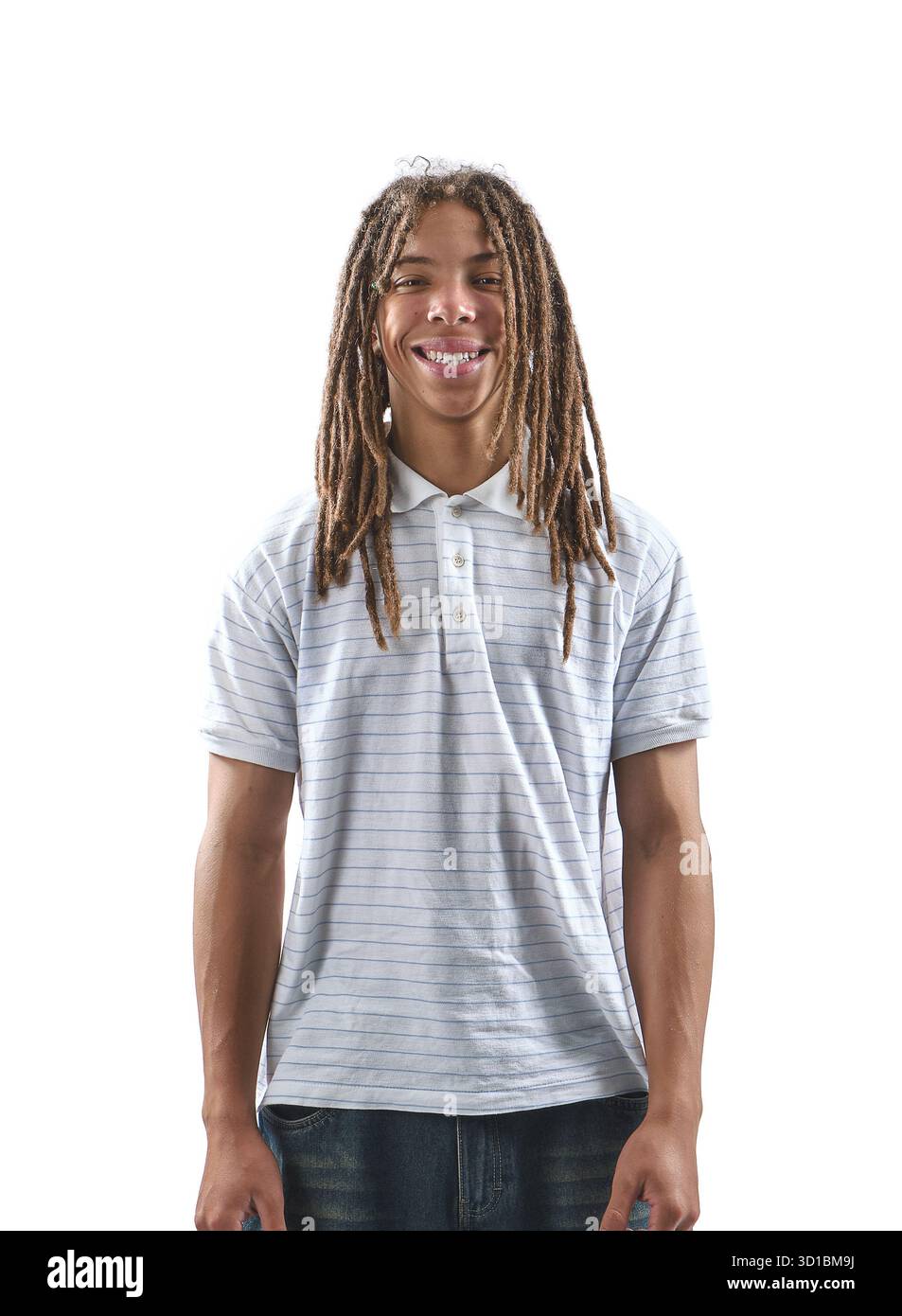 Young black man with dreadlocks standing and smiling at camera Stock Photo
