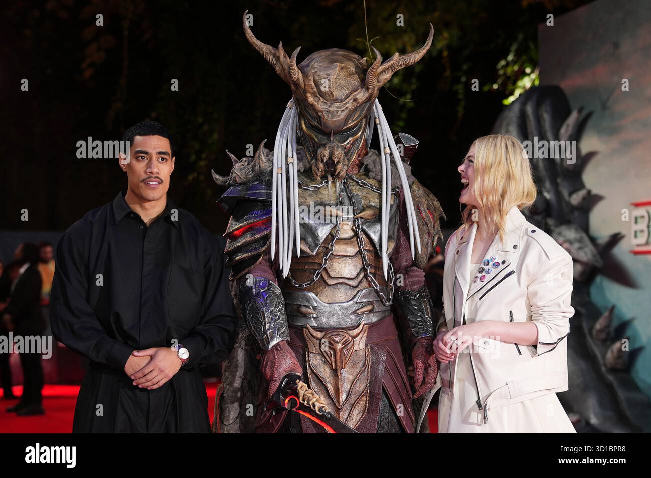 Dimitrius Acrey Dimitrius Koloamatangi, left, and Elle Fanning pose for photographers ...