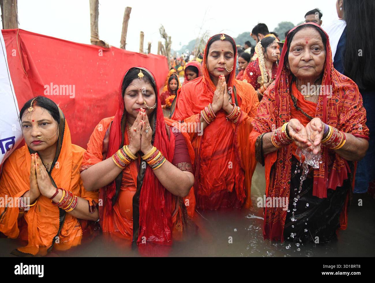 PATNA, INDIA - OCTOBER 27: Chhath devotees perform rituals in the Ganga ...