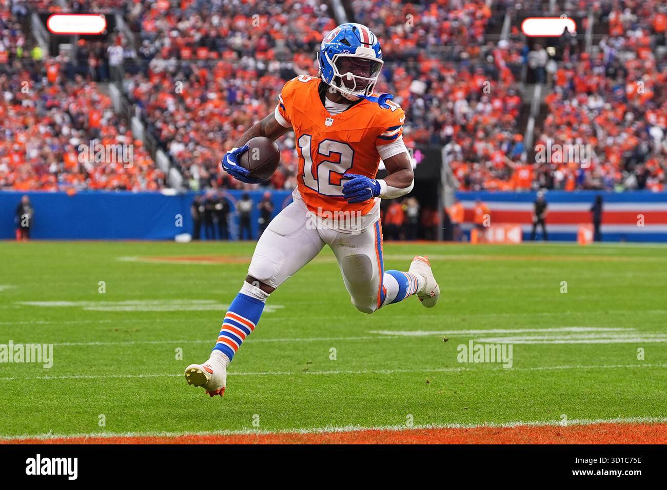 Denver Broncos running back RJ Harvey (12) runs for a touchdown after catching a pass from ...