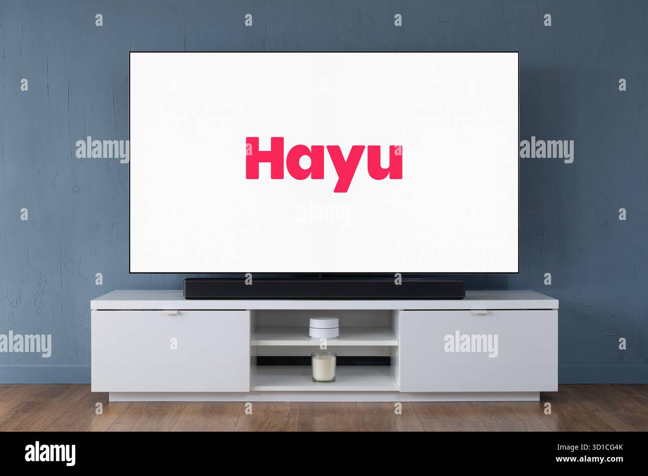 The Hayu streaming service logo is seen on a modern OLED widescreen TV. Stock Photo