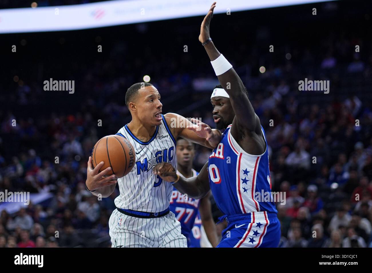 Orlando Magic's Desmond Bane, left, goes up for a shot against ...