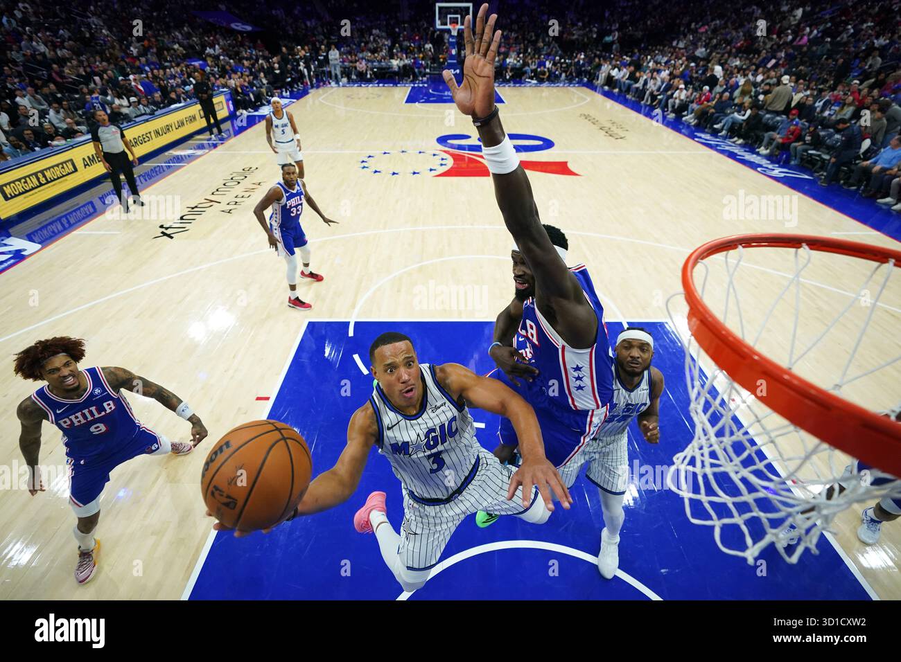 Orlando Magic's Desmond Bane, left, goes up for a shot against ...