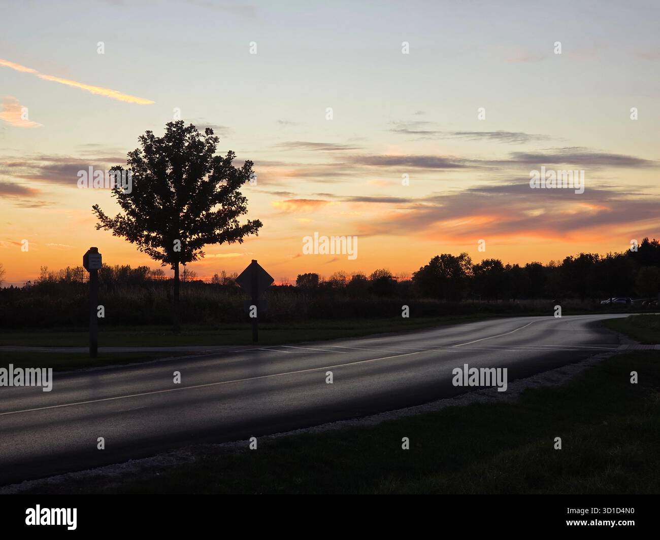 Sunset reflecting across quiet lake - Smartphone Captured Stock Image