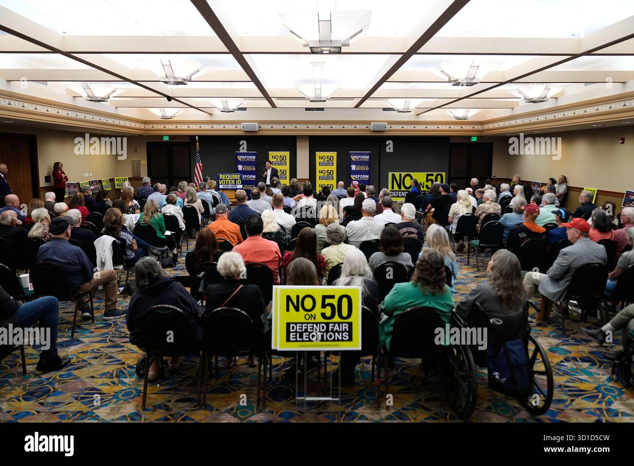 Republican Assembly member Carl DeMaio, center rear, speaks to people ...