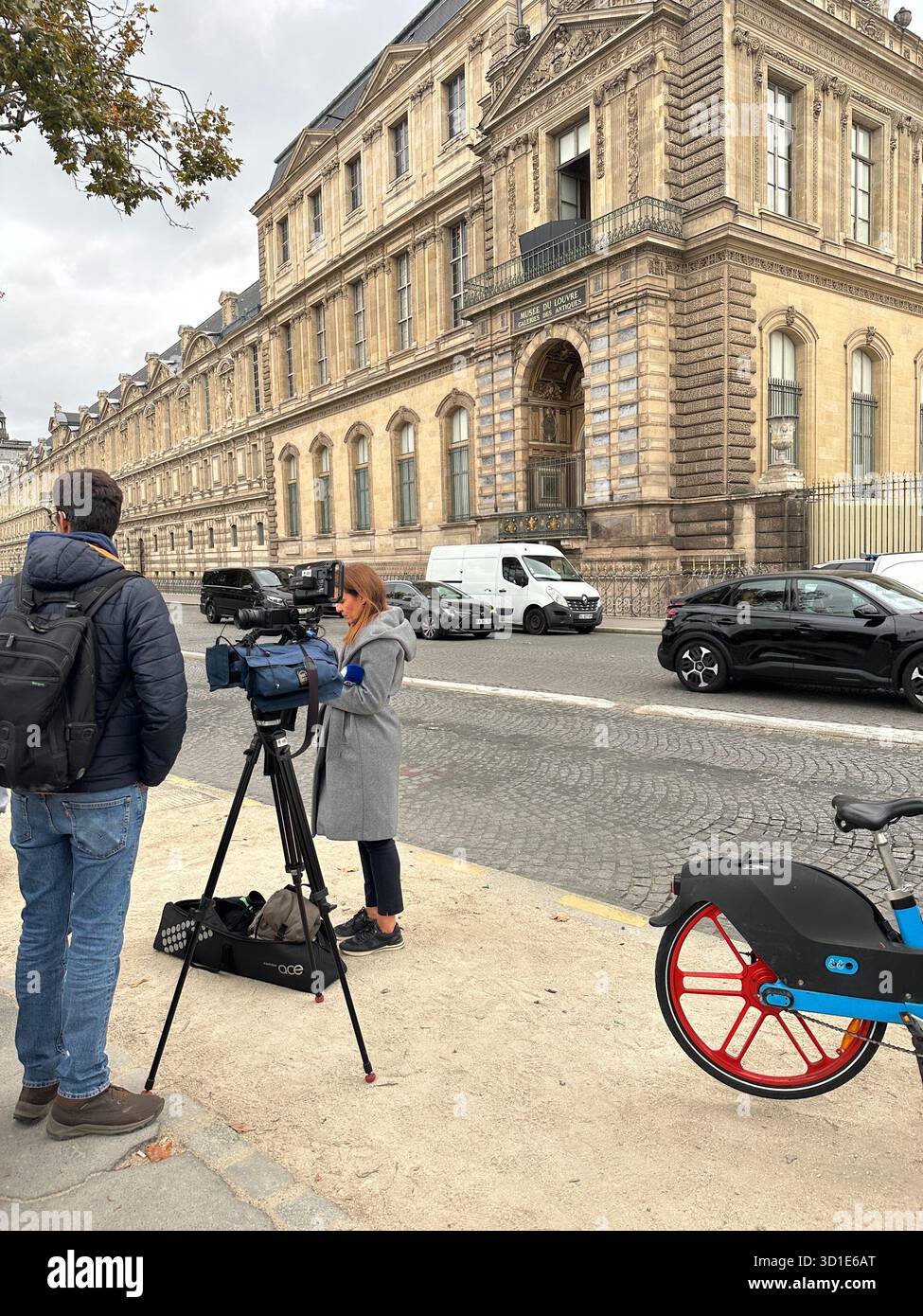 Louvre heist Paris 29 October 2025. Jewels robbery. Open window at historic facade. Street scene with tourists. Crime scene becomes tourist attraction - Smartphone Captured Stock Image
