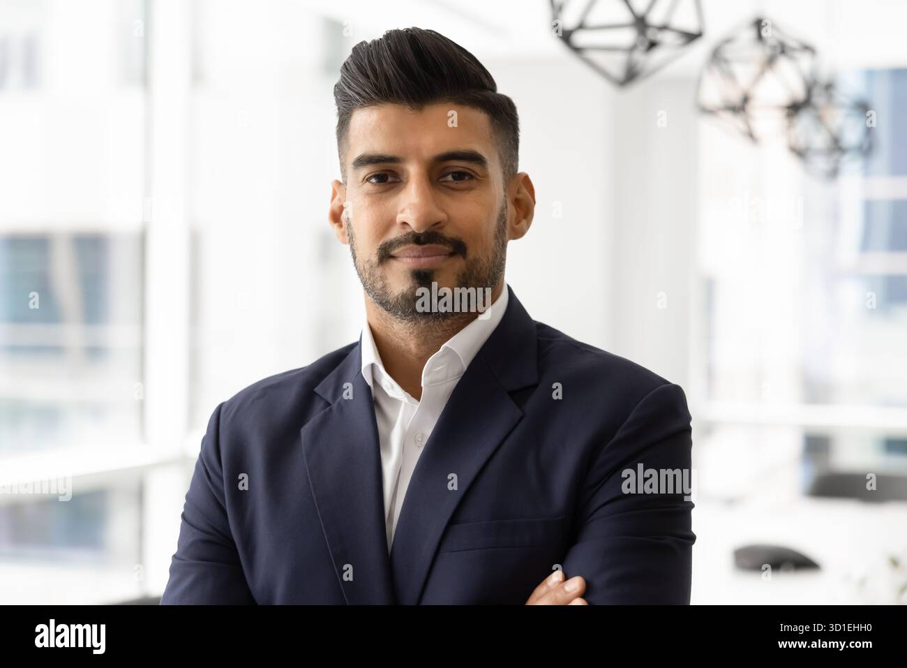 Portrait of confident young Indian business executive looking at camera Stock Photo