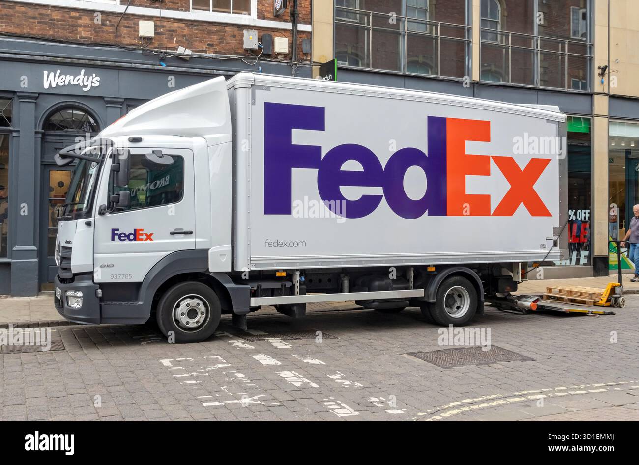 FedEx courier delivery van lorry delivering to businesses in the town city centre York North Yorkshire England UK United Kingdom GB Great Britain Stock Photo