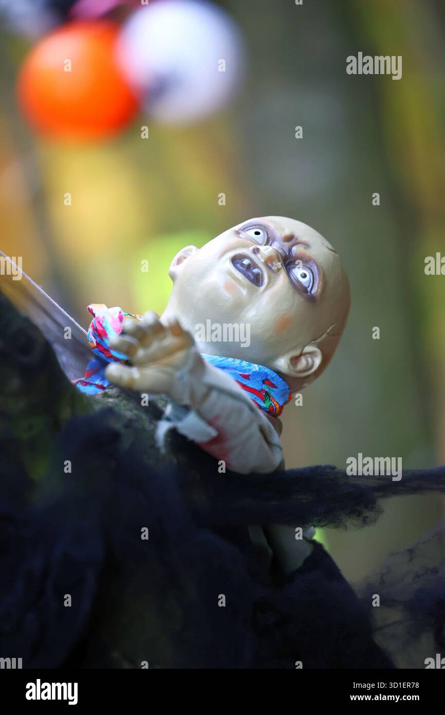 Creepy Zombie Baby Halloween Decoration outdoors Stock Photo