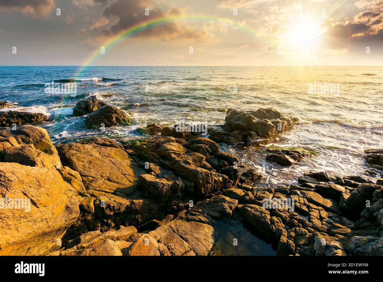 weekend on a rocky beach at the black sea under open blue sky at sunset. beautiful coastline in summer. seascape scenery with clouds above horizon in Stock Photo