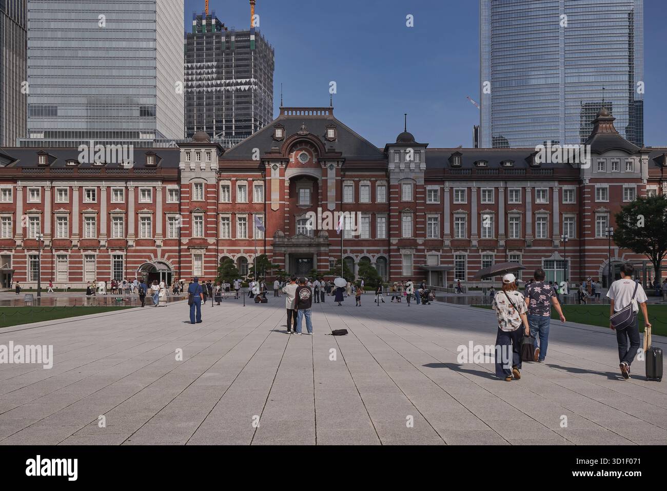 The Iconic Red Brick Tokyo Station with Skyscrapers - Japan Stock Photo ...