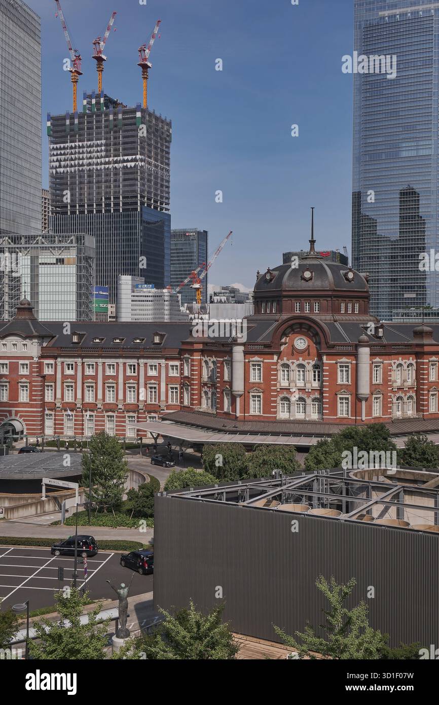 The Iconic Red Brick Tokyo Station with Skyscrapers - Japan Stock Photo ...