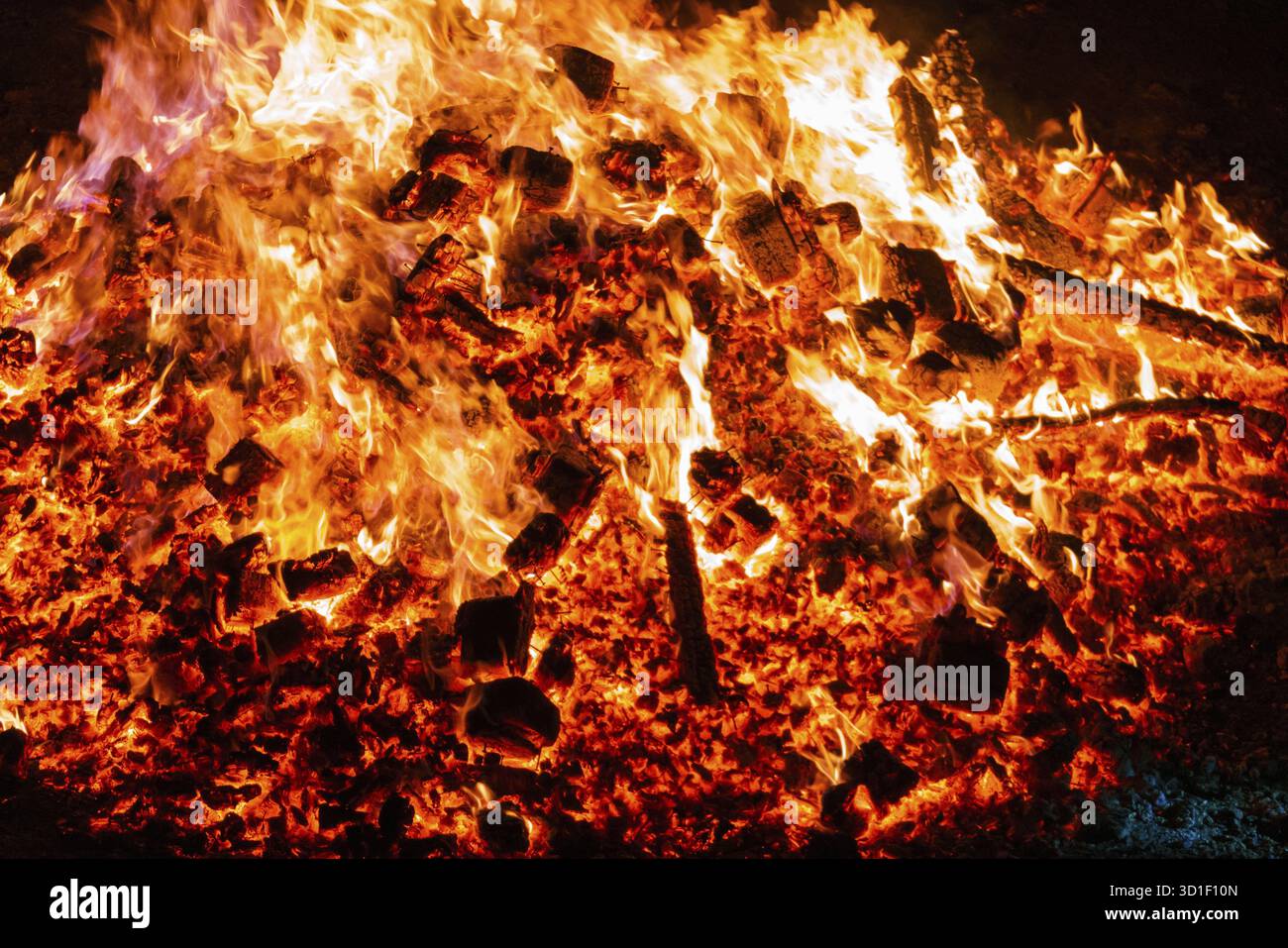Burning coals from a fire abstract background Stock Photo