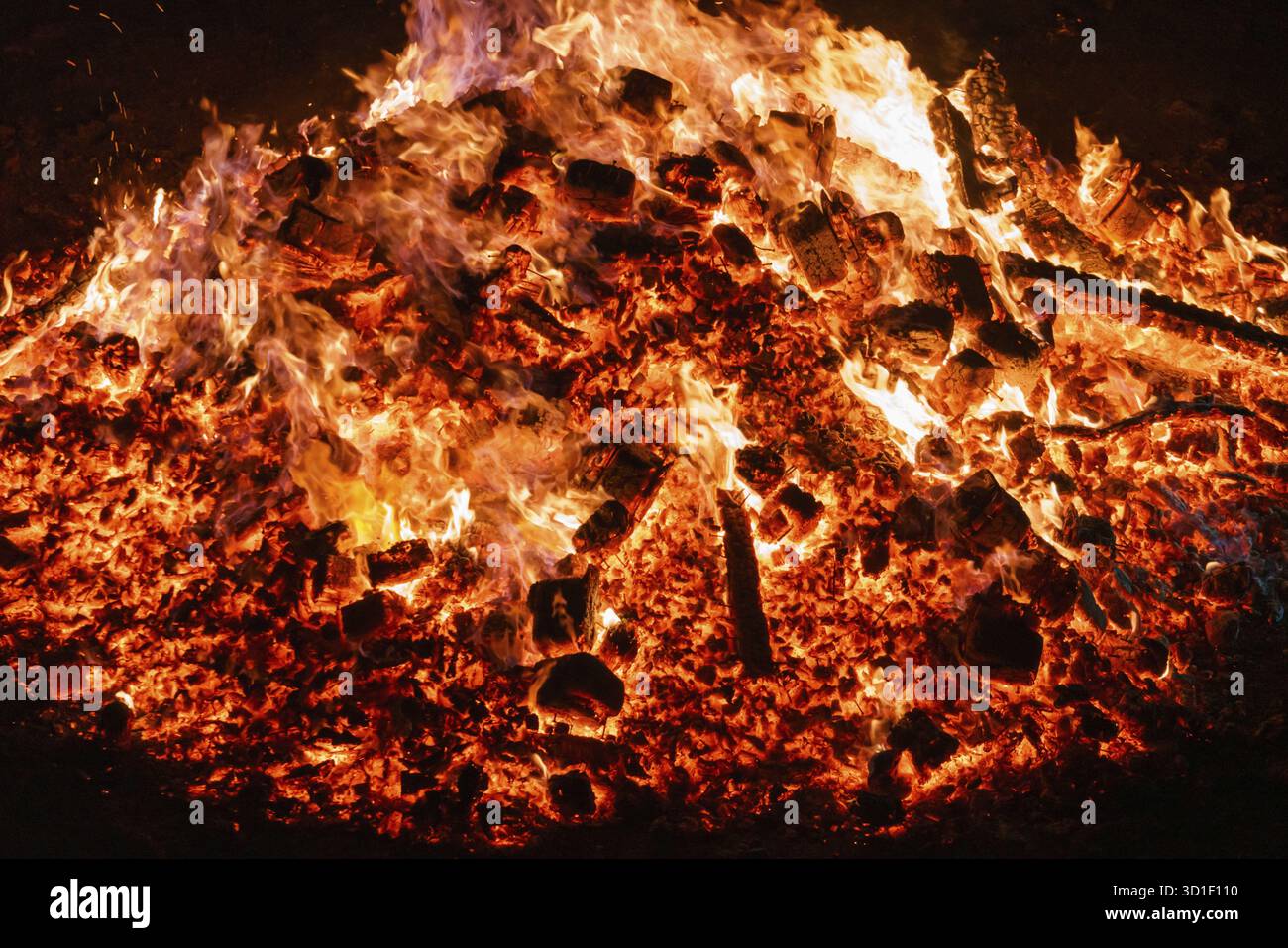 Burning coals from a fire abstract background Stock Photo