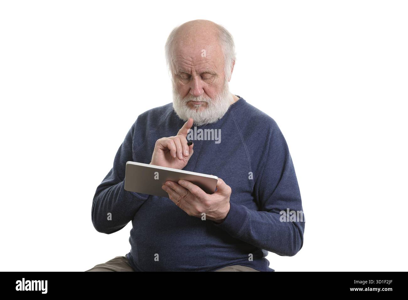 Funny bald and bearded old man using tablet computer, isolated on white Stock Photo
