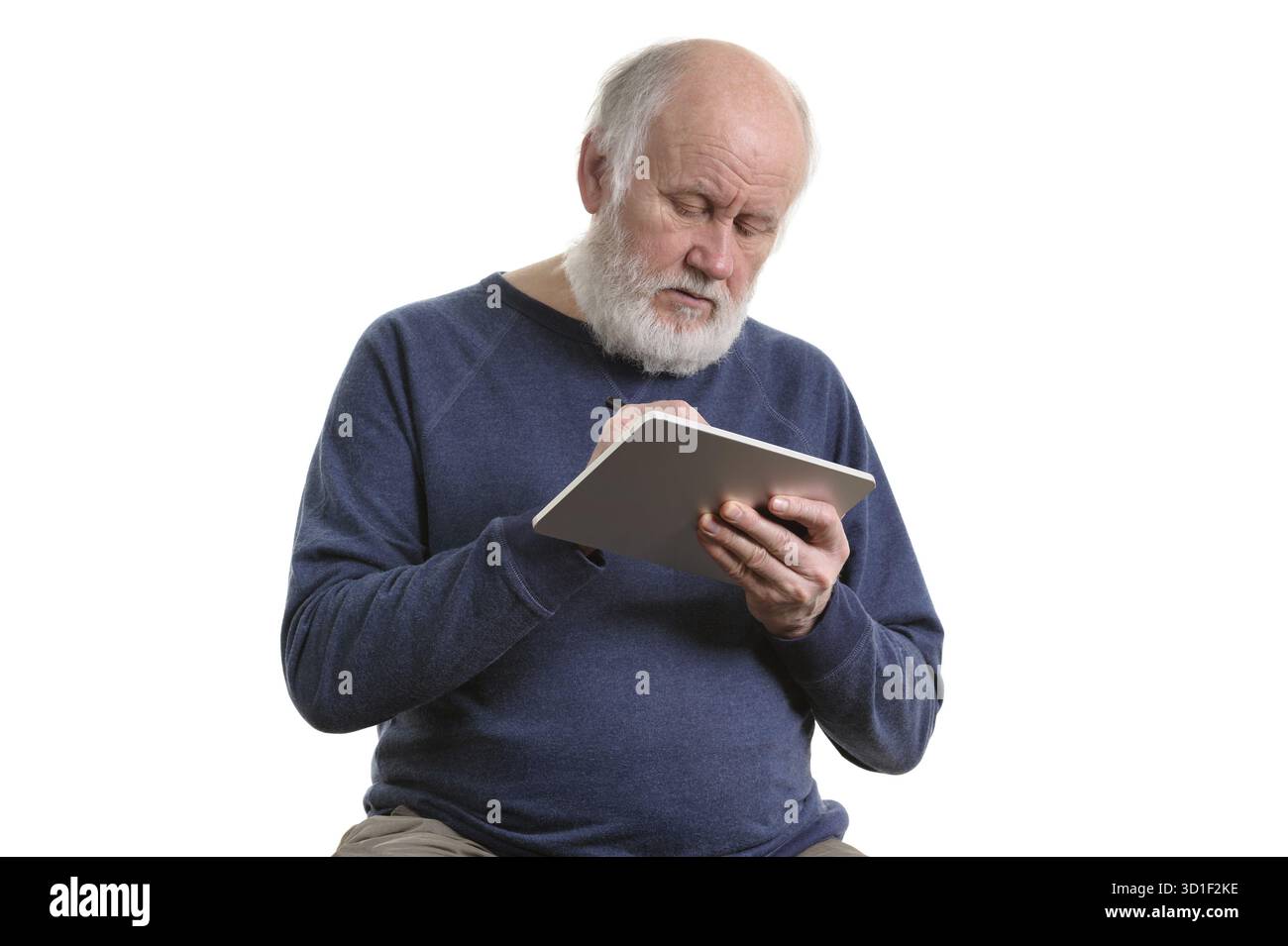 Funny bald and bearded old man using tablet computer, isolated on white Stock Photo