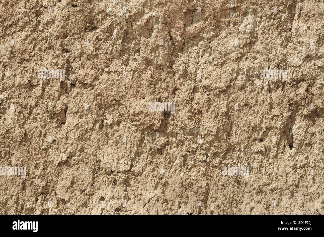 Yellow red clay earthen wall texture background Stock Photo
