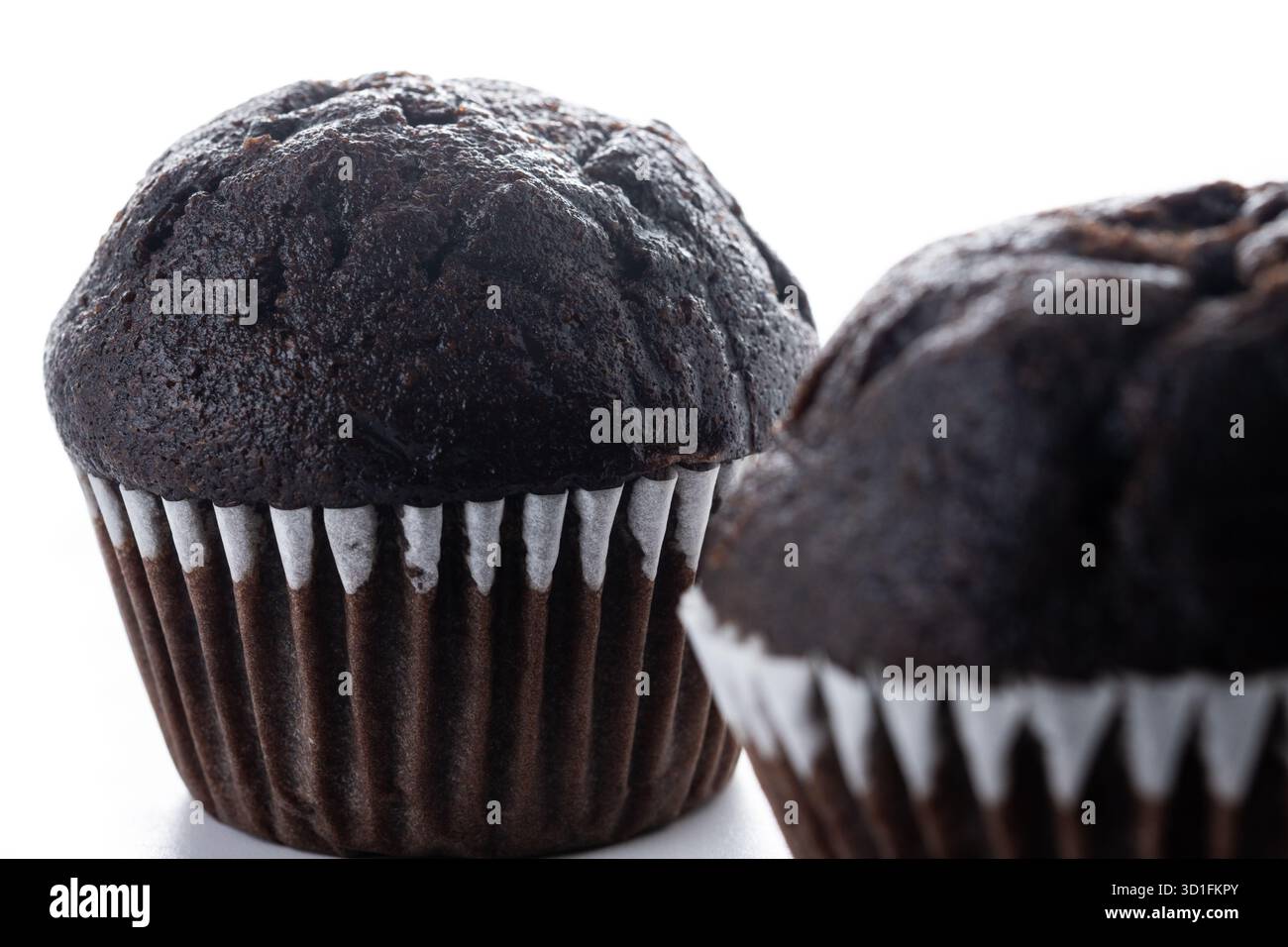 Chocolate muffins isolated on white background Stock Photo