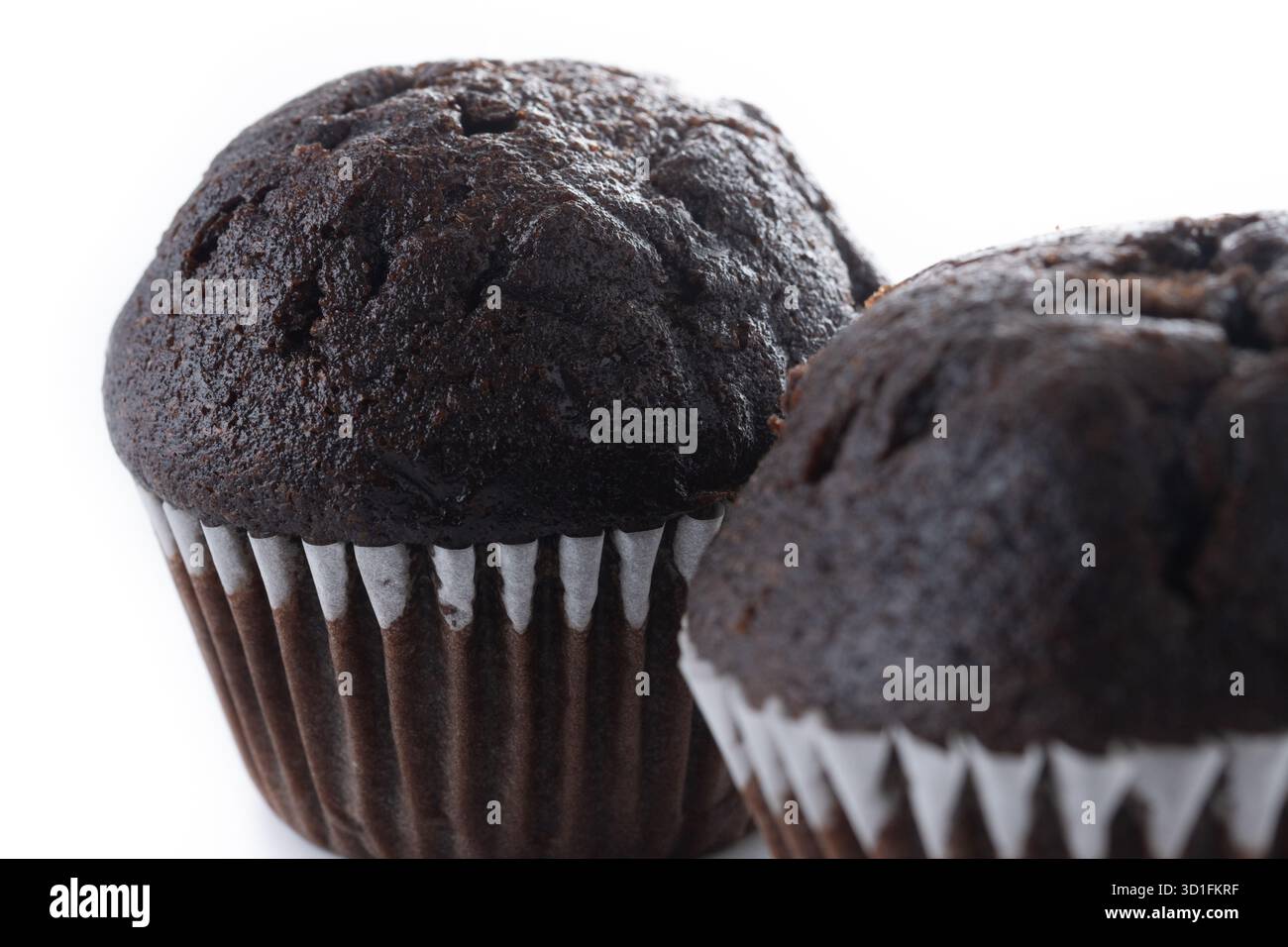 Chocolate muffins isolated on white background Stock Photo