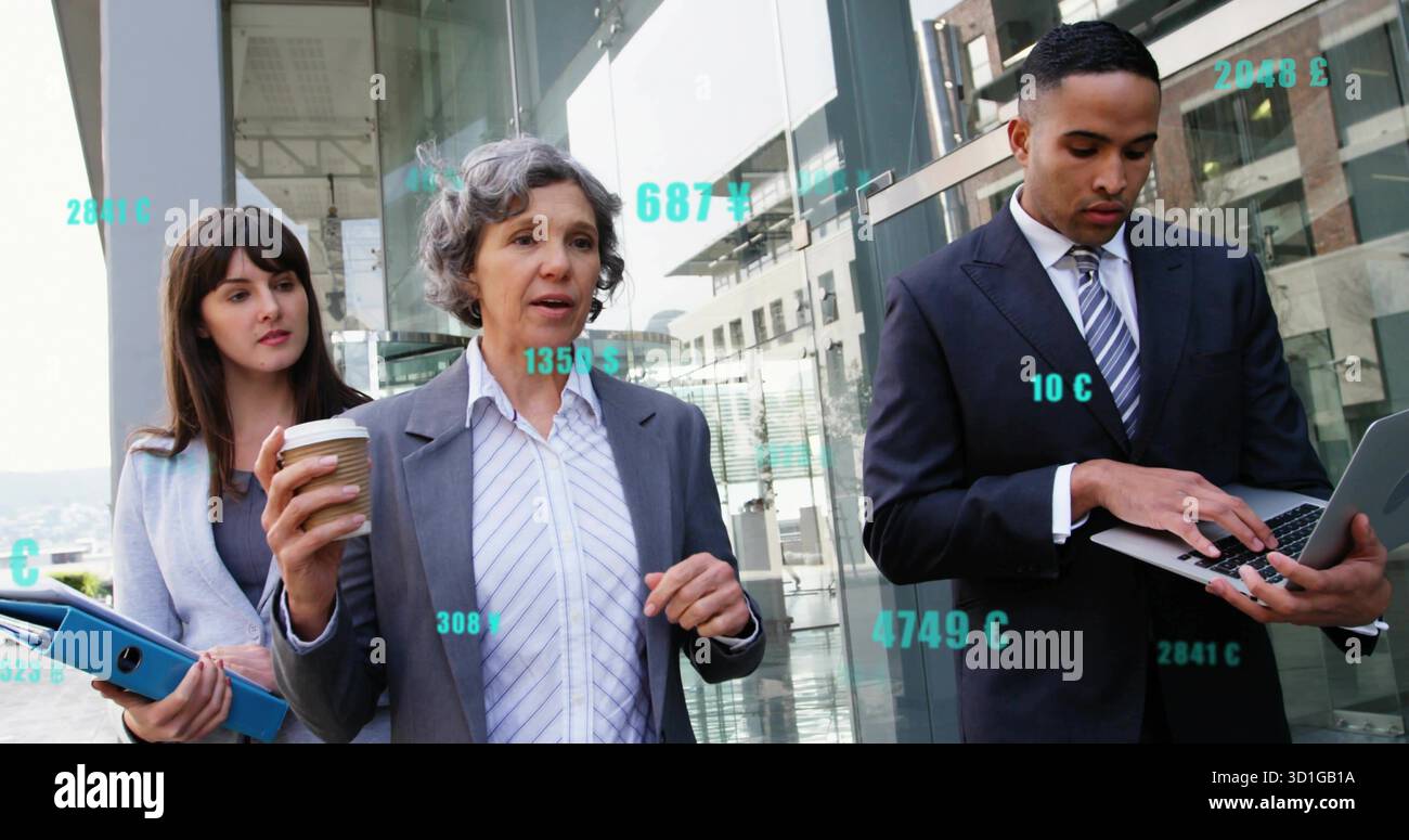 Walking team in suits discussing plan outside glass building with coffee cup blue binder laptop Stock Photo