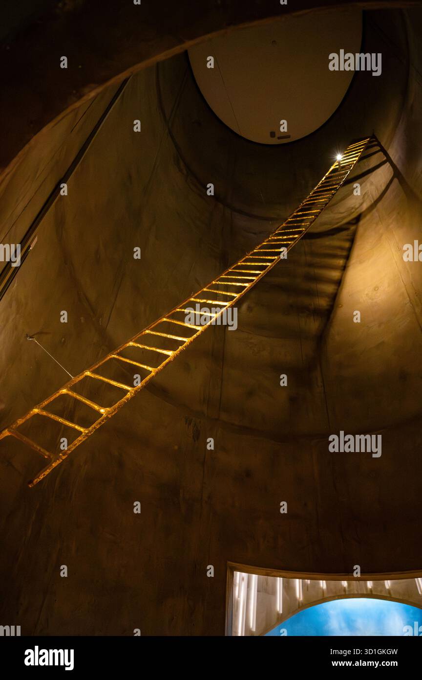 Northern Lights Cathedral, Alta, Norway, ladder ascends a dimly lit ...