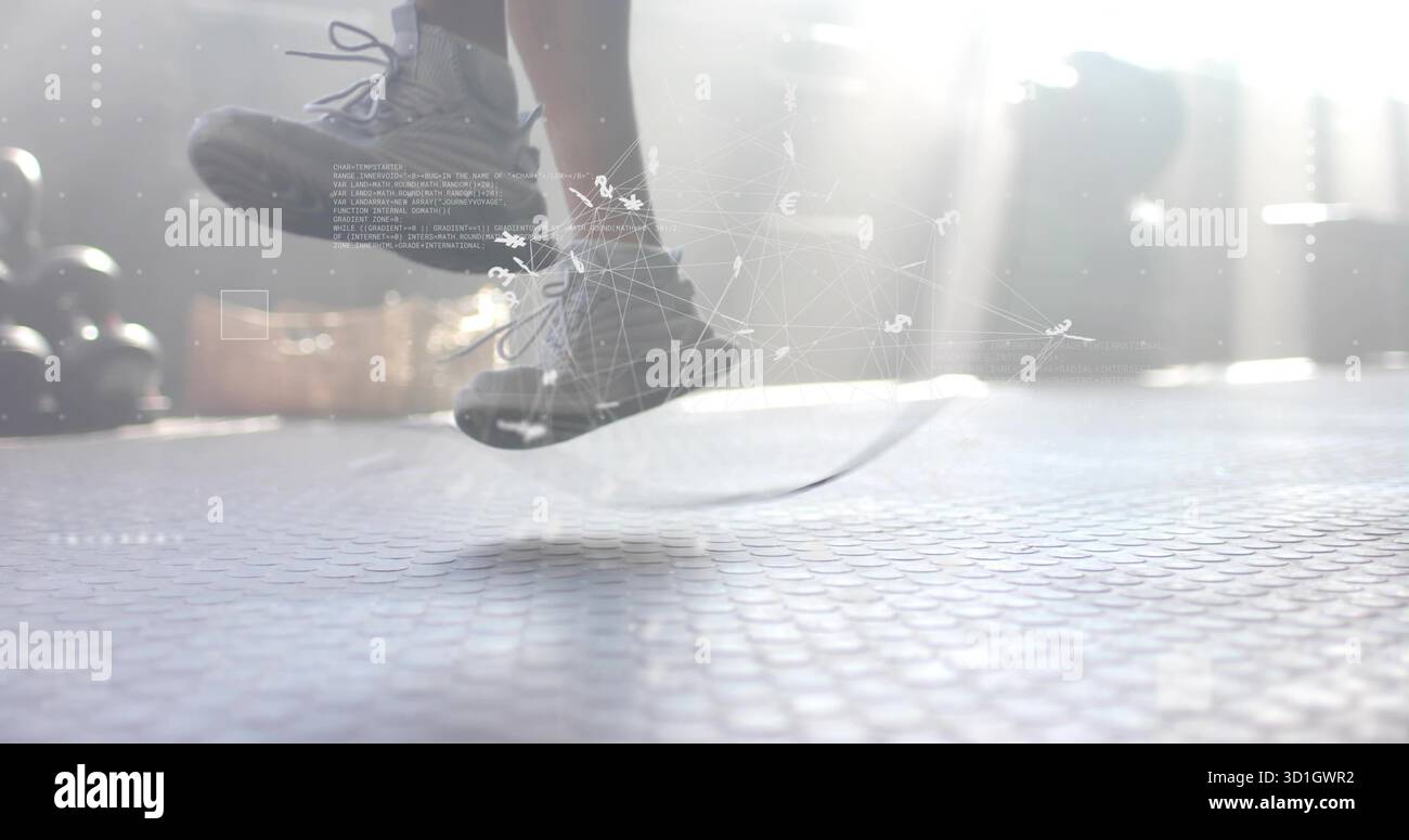 Skipping athletic male jumping over rope on rubber gym floor, with ...