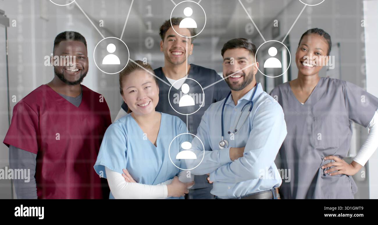 Smiling scrub-clad medical staff standing in hospital hall, with stethoscope and network icons Stock Photo