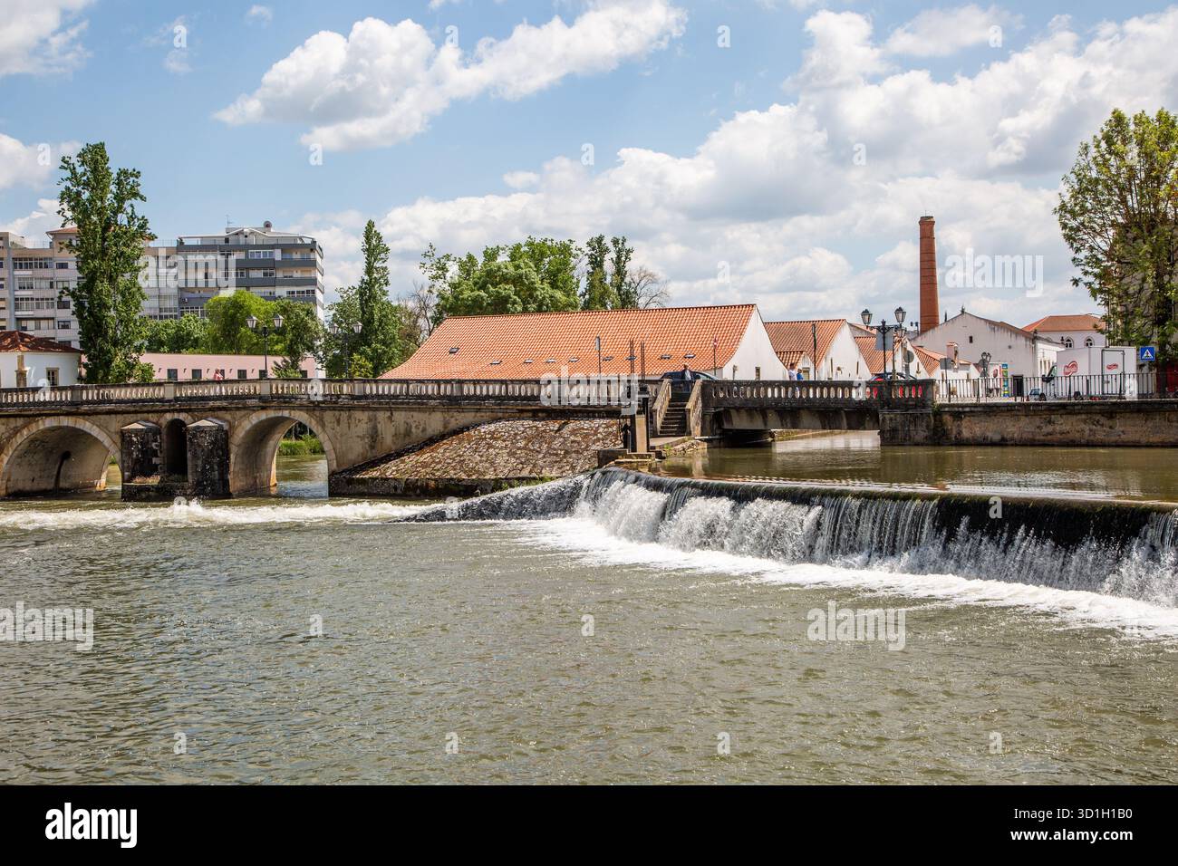 The river Rio Nabão as it flows through the Portuguese city of Tomar the former home of the Knights Templar Stock Photo